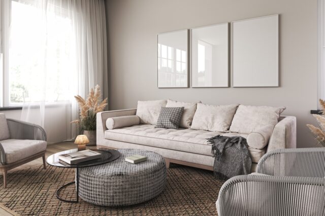 Modern scandinavian interior living room. Three picture frame. Empty wall mockup in white room with wooden floor and lots of dry plants. 3d render. High quality 3d illustration 5 trendů v obývacím pokoji: novinky, které oživí váš domov