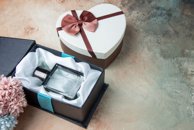 bottom-view-men-cologne-box-heart-shaped-box-flowers-table