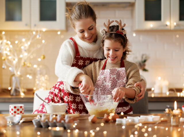 happy family mother and child bake christmas cookies