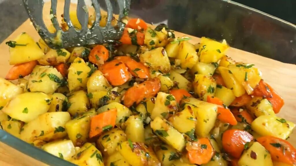 Baked delicious honey chicken thighs in a mild sauce with vegetables and potatoes