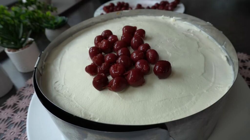 A stunning fruit cake with cottage cheese and cherry cream with mascarpone