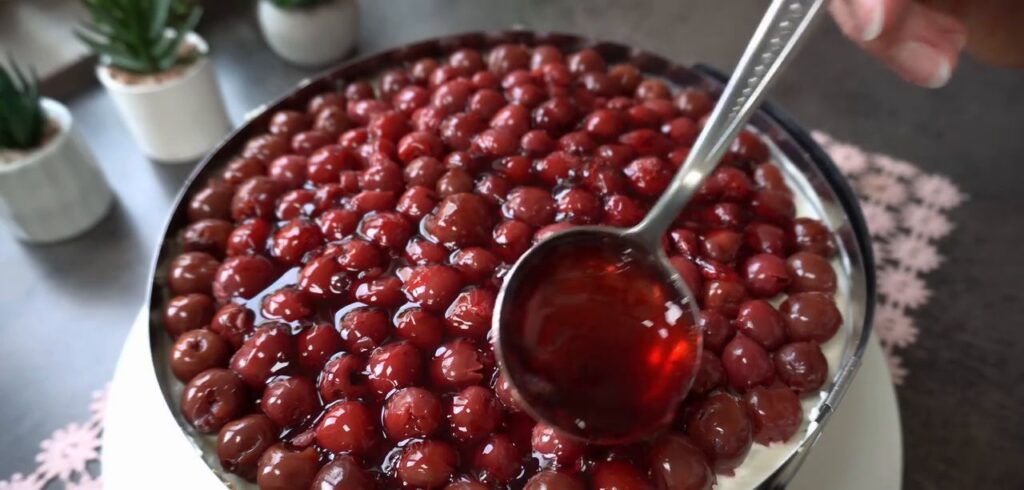 A stunning fruit cake with cottage cheese and cherry cream with mascarpone