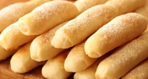 Nadýchané jablečné rohlíčky se skořicí – snadný a voňavý recept na domácí pečivo! Nadýchané jablečné rohlíčky s vůní skořice a sladkým posypem: Rychlá a jednoduchá příprava!