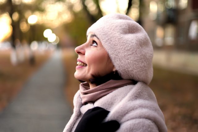 Autumn Joy - A Mature Woman Looks With Delight At The Autumn Sky. Positive Emotions Concept