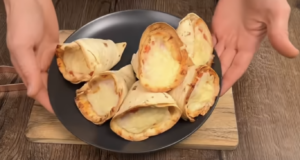 Křupavé tortillové rolky plněné kuřecím masem a sýrem Zapečené kužely z tortilly plněné kuřecím masem, rajčaty a sýrem Suluguni