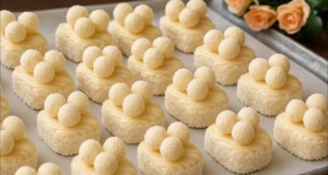 Kokosové dezertíky s bílou čokoládou a domácími mini Raffaello kuličkami Kokosové dezertíky s bílou polevou, kondenzovaným mlékem a mini RAFFAELLO kuličkami