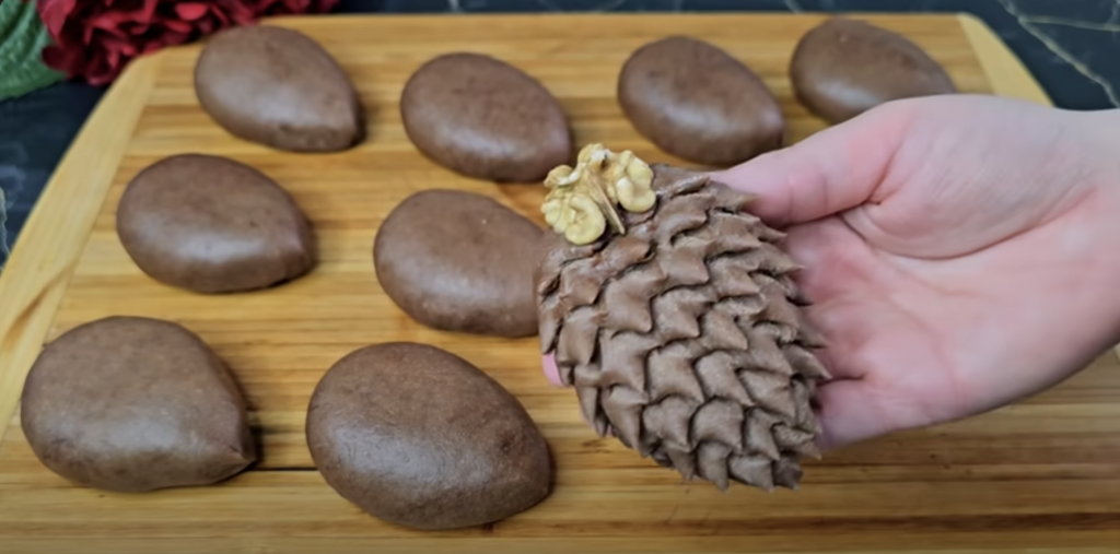 Půvabné kakaové šišky ze zakysané smetany, plněné sladkou ořechovou náplní a provoněné jemnou vanilkou - ideální pro každou příležitost