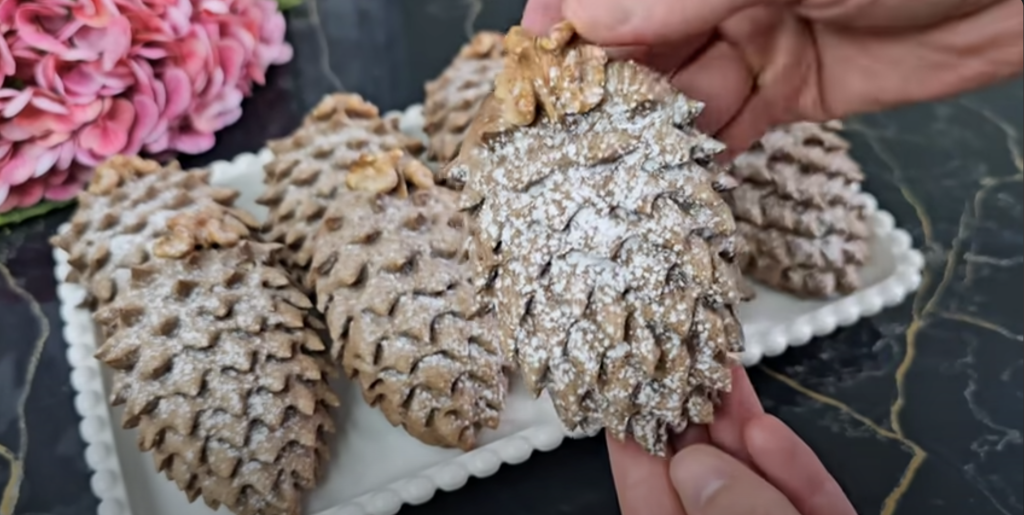 Půvabné kakaové šišky ze zakysané smetany, plněné sladkou ořechovou náplní a provoněné jemnou vanilkou - ideální pro každou příležitost