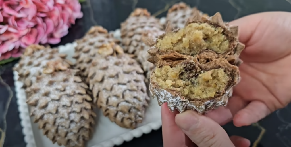 Půvabné kakaové šišky ze zakysané smetany, plněné sladkou ořechovou náplní a provoněné jemnou vanilkou - ideální pro každou příležitost