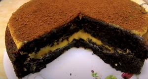 Kakaový koláč s pomerančovým krémem Nadýchaný kakaový koláč s jemným pomerančovým krémem - ideální volba ke kávě