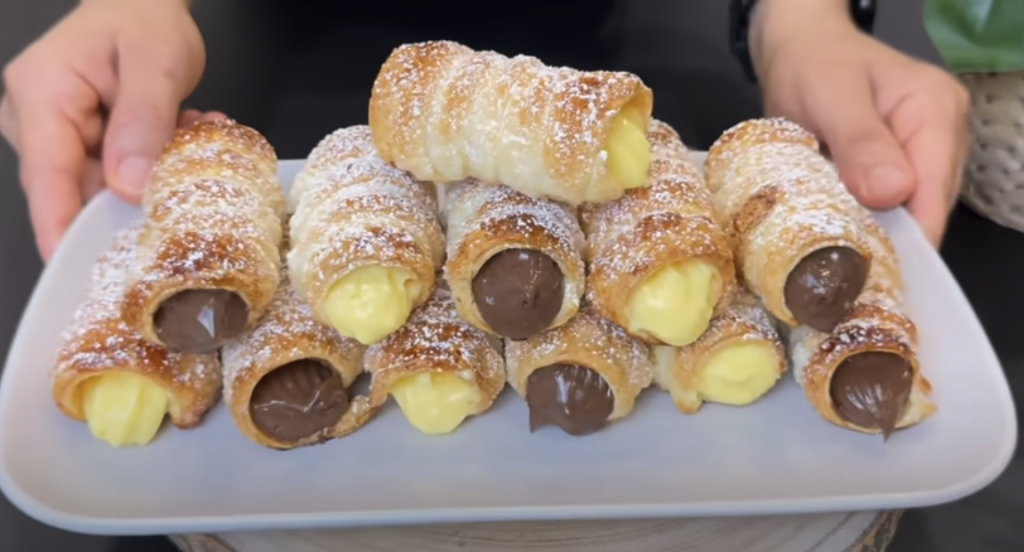 Elegantní listové trubičky plněné vanilkovým a čokoládovým krémem - jemně křupavý dezert s bohatou náplní, který okouzlí každého mlsouna