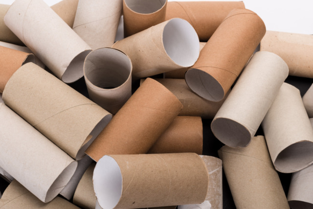 Empty Toilet paper Rolls Stack Up On a Black Background Toaletní ruličky.