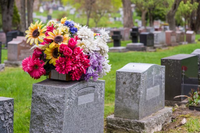 Flowers on a tombstone in a cemetary