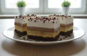 Kinder Bueno řezy: Prudce návykový dezert, který okouzlí každou návštěvu Kinder bueno řezy s nadýchaným ořechovým korpusem, dvěma pudinkovými krémy a šlehačkou.